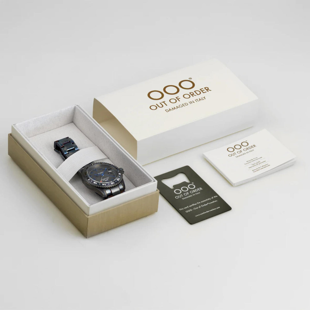 Men's wristwatch in gift box with documents and cards, shown with dark bracelet and blue dial
