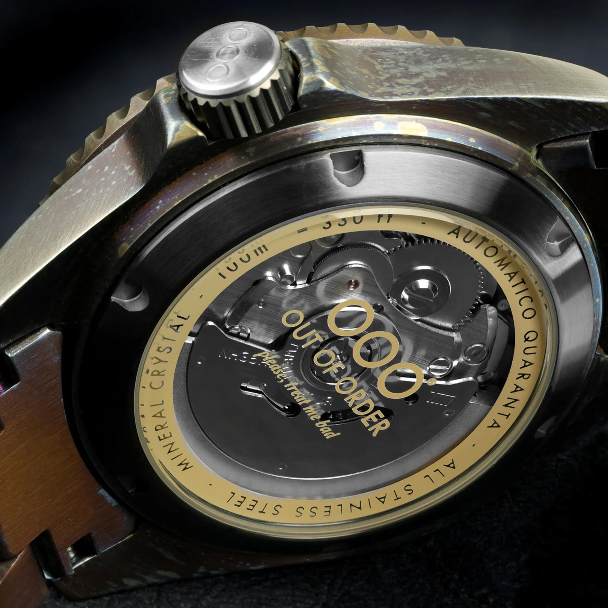 Men's automatic watch caseback with exposed mechanism and sand-toned circular detail