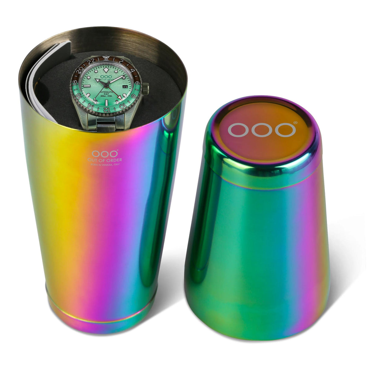 Holographic rainbow metal container set with mint dial watch partially visible
