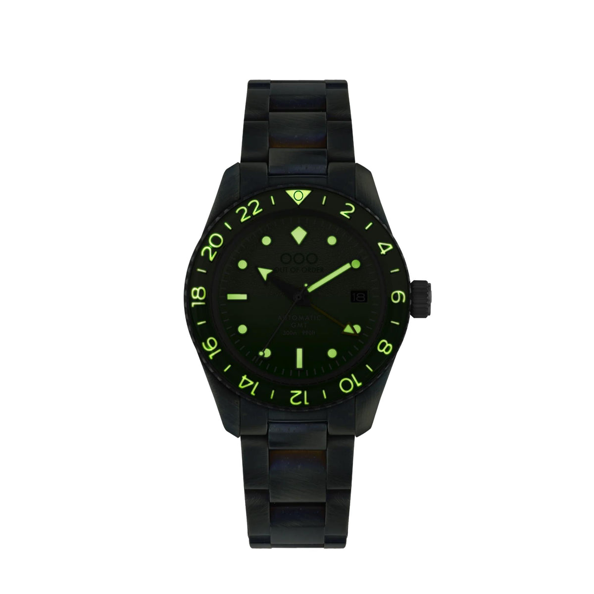 Men's automatic GMT wristwatch with dark case, green glow dial, and black metal bracelet