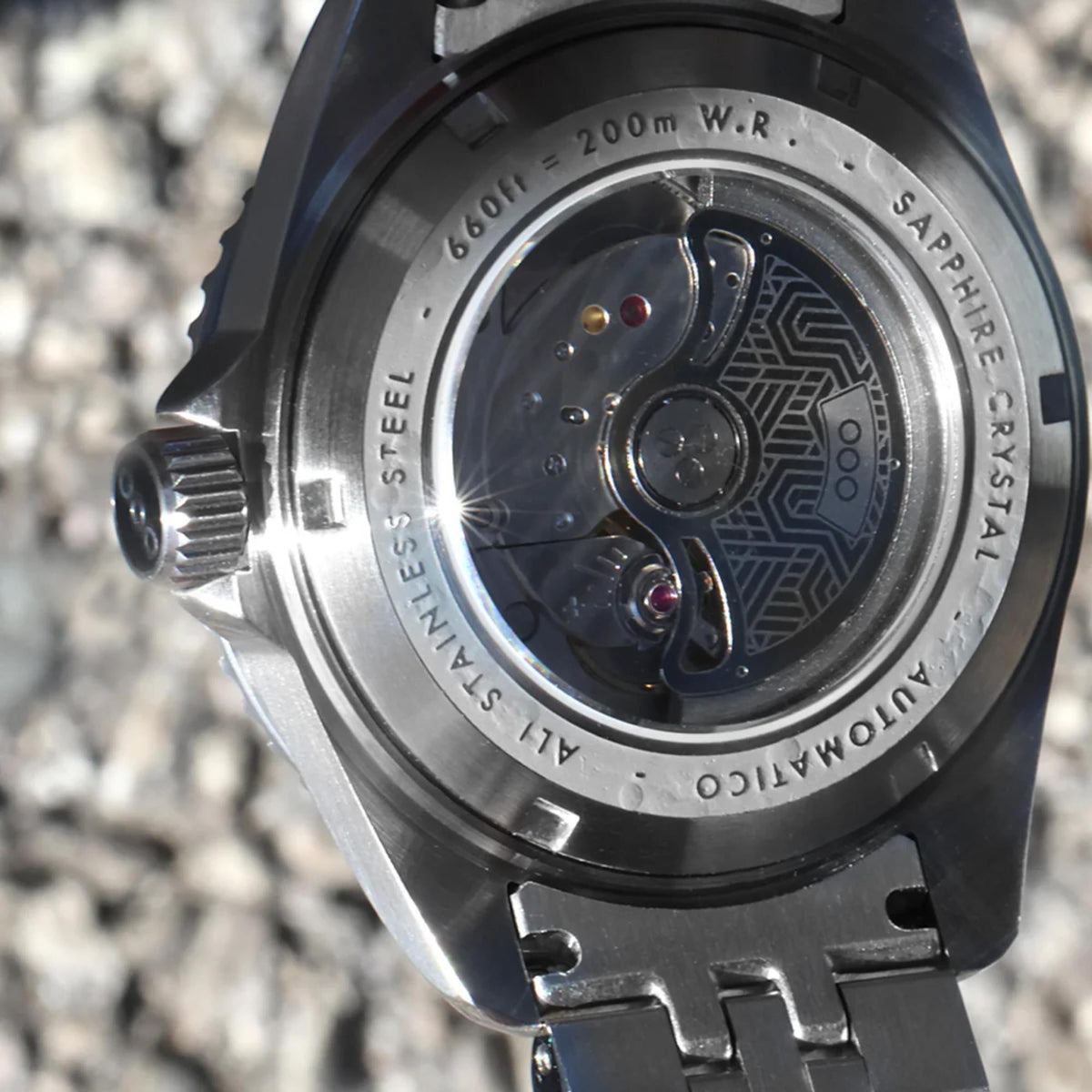 Stainless steel watch caseback with see-through back and detailed movement rotor