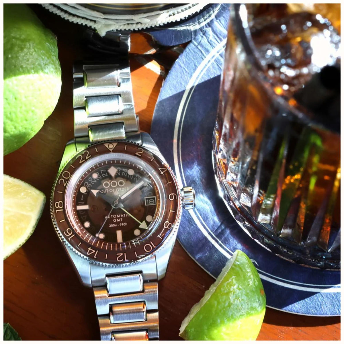 Men's automatic steel wristwatch on bracelet with brown dial and lumed bezel