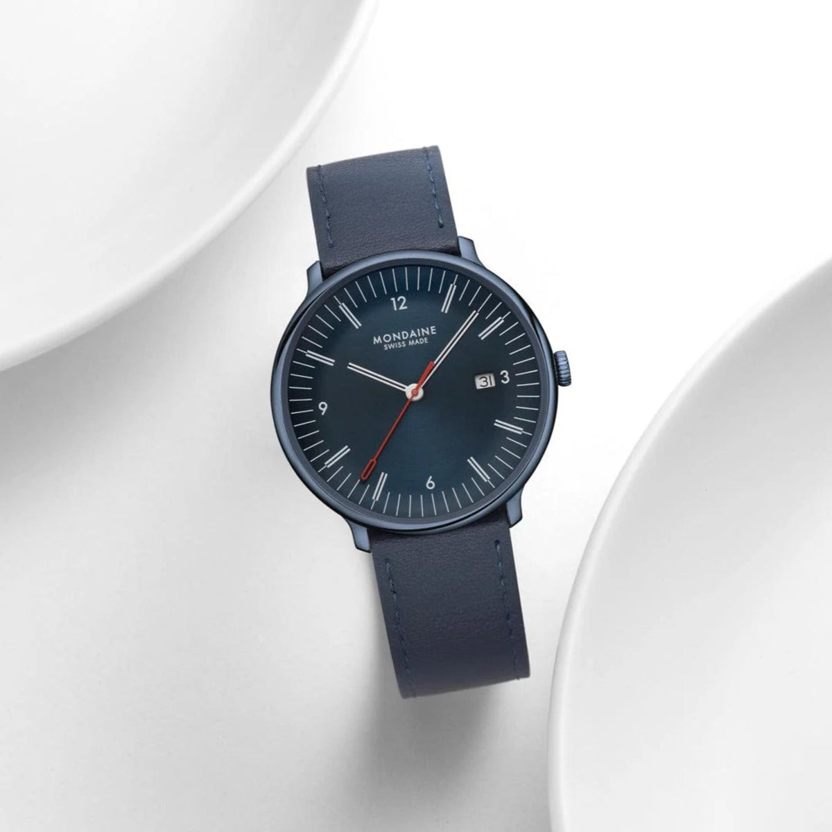 Mondaine Doppio MLE.41240.LDV blue dial watch styled flat lay presentation on a white background