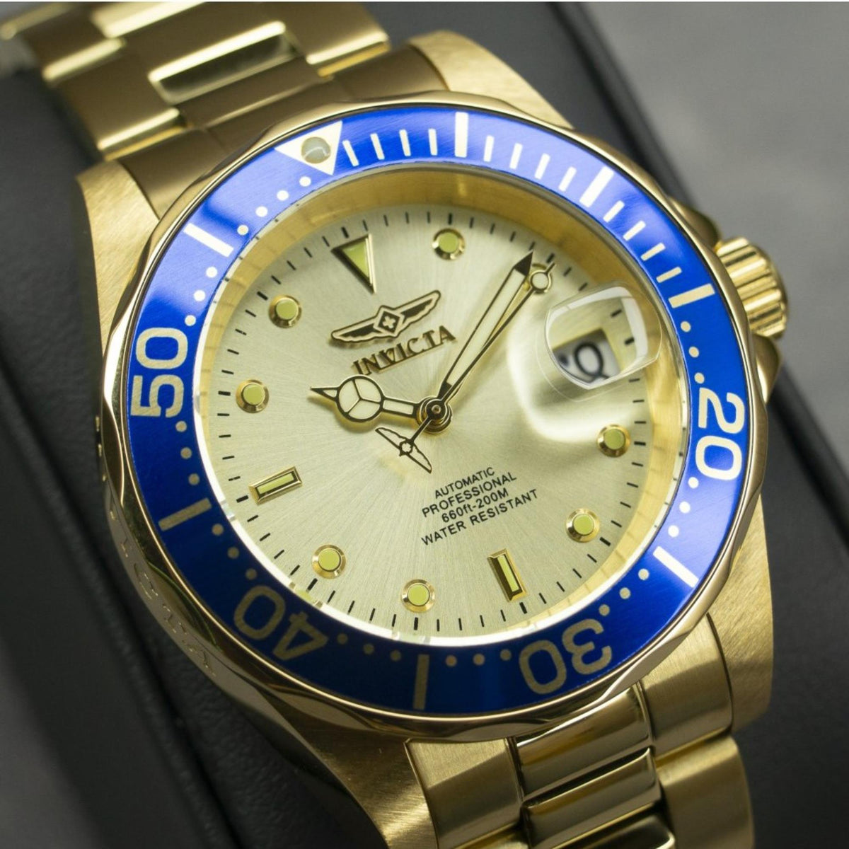 Invicta Pro Diver watch with champagne dial, blue bezel ring, seconds marker and date