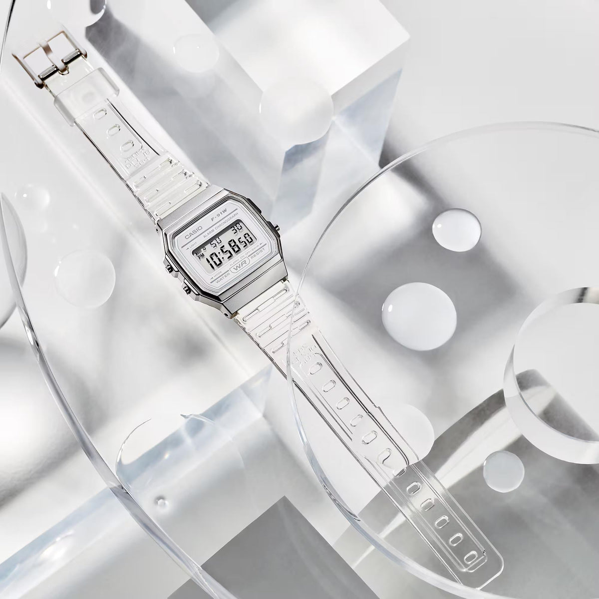 Casio digital quartz watch with clear resin strap and silver case, close view of face