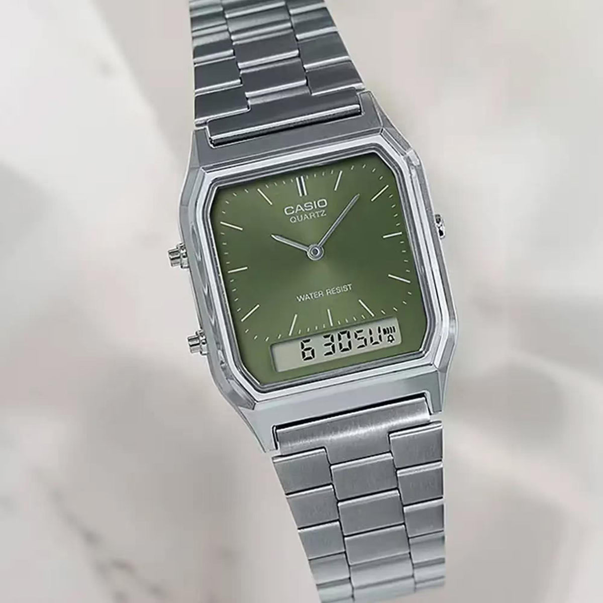 Green dial Casio quartz watch with stainless steel bracelet, full front view