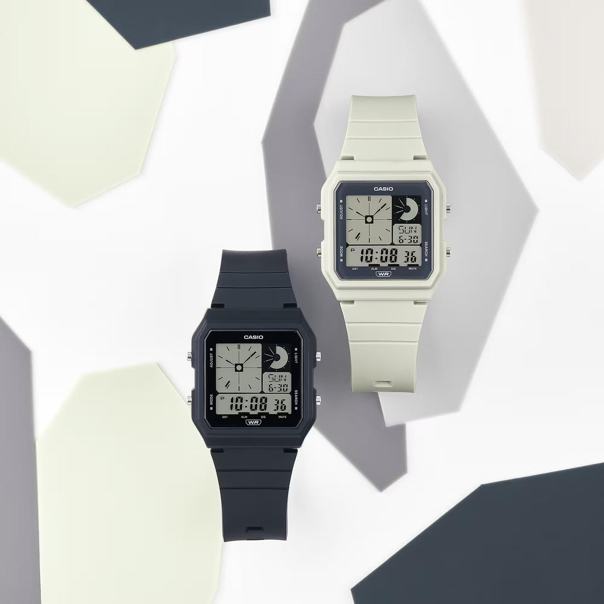 Two Casio POP digital watches: black and light resin straps with LCD displays