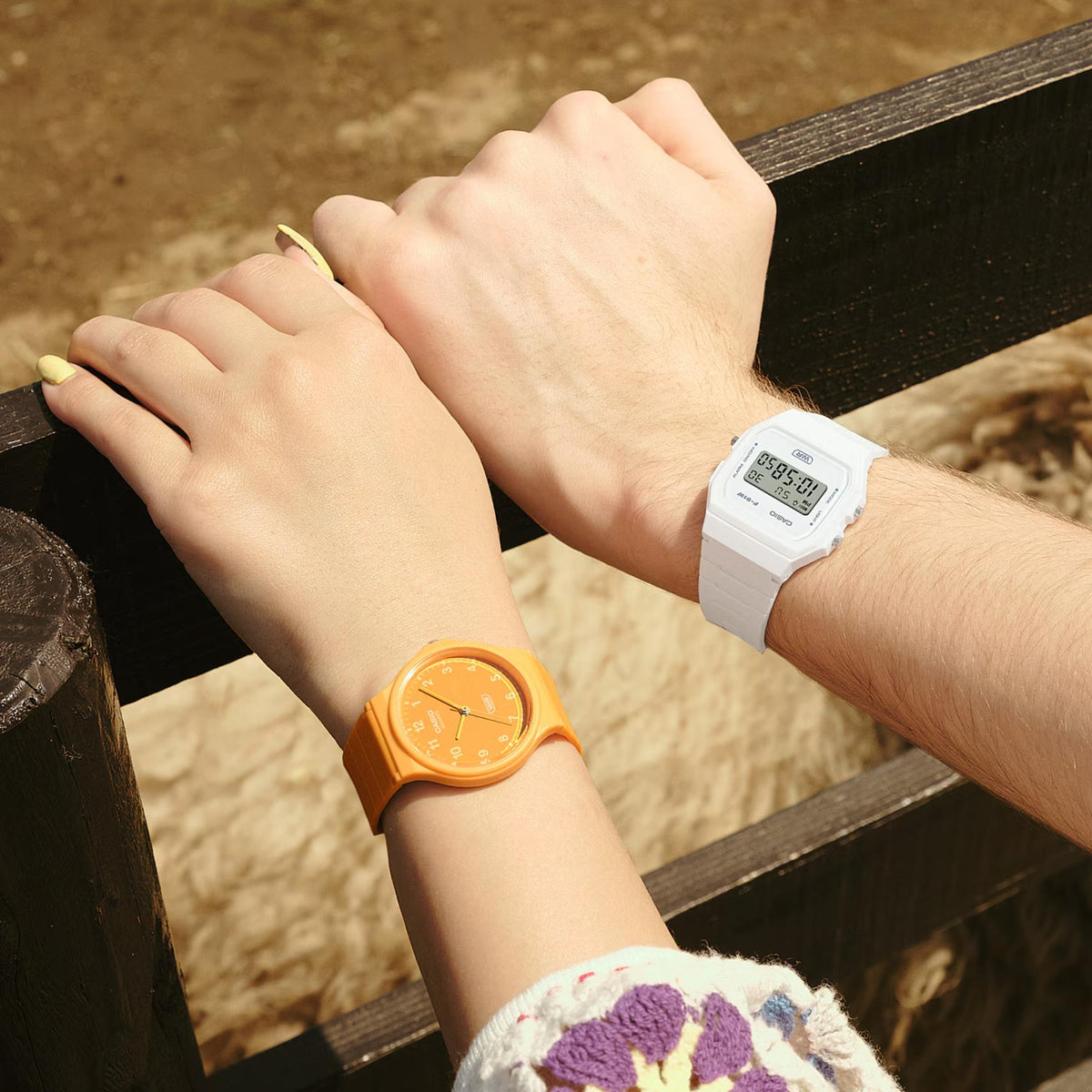 White resin strap digital quartz watch on wrist with digital time display