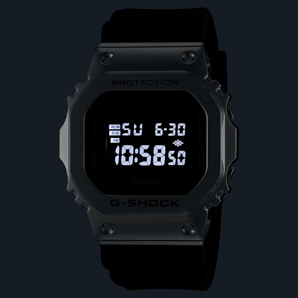 Black G-Shock digital watch with dark resin strap and illuminated LCD time