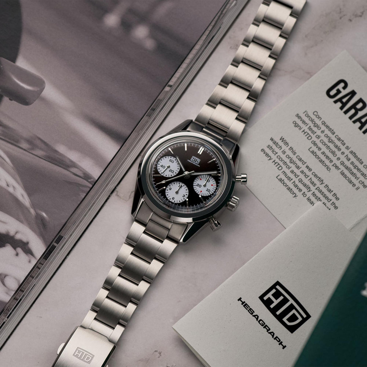 Men's steel chronograph watch on bracelet, dark dial with three subdials