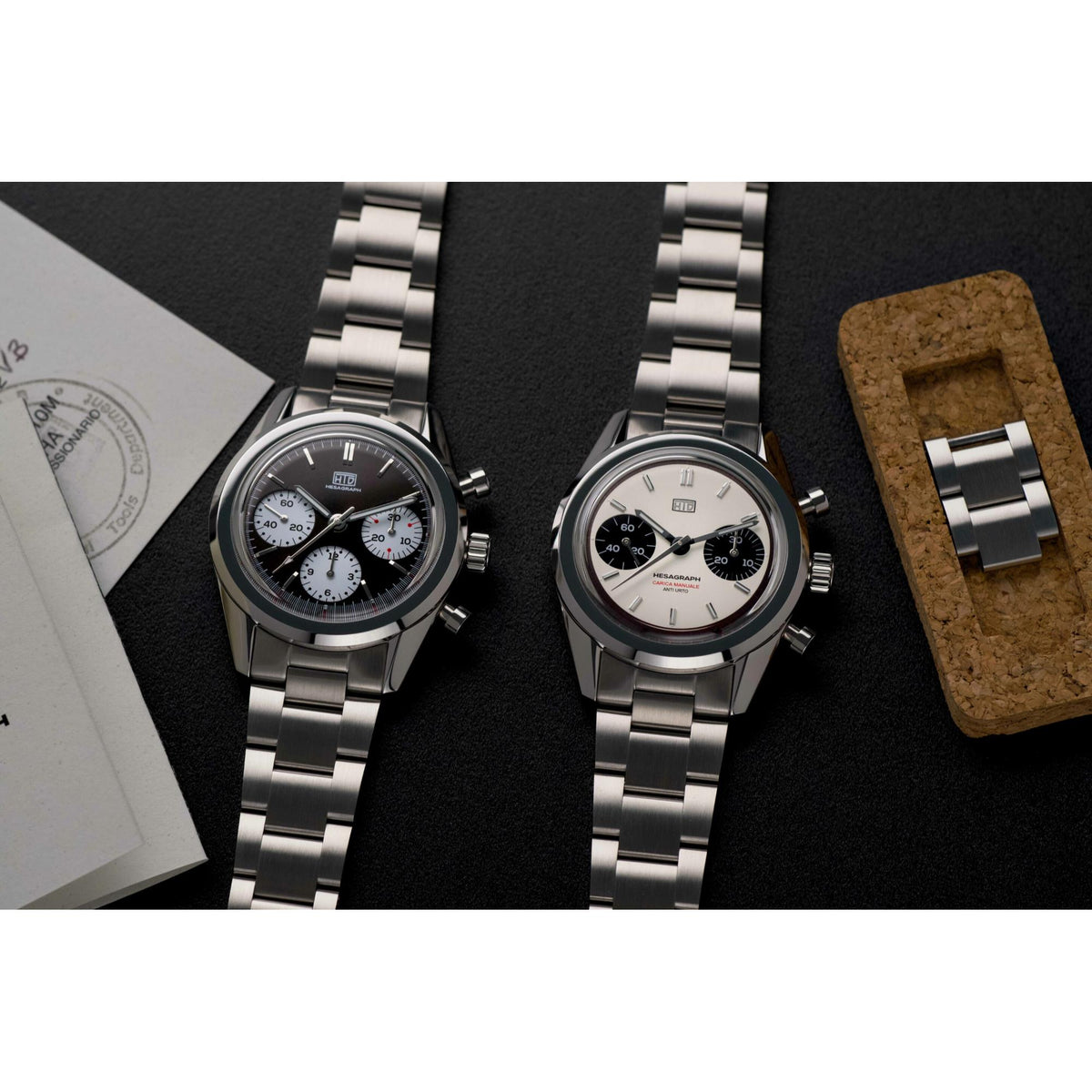 Two men's chronograph watches with steel bracelets and dark dials, three subdials each