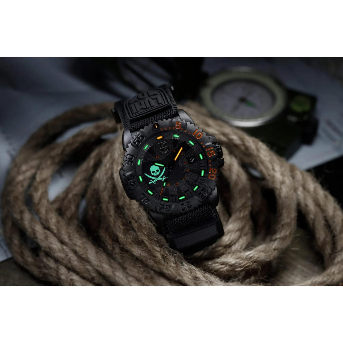 Black Luminox watch with green glowing markers on a black fabric strap