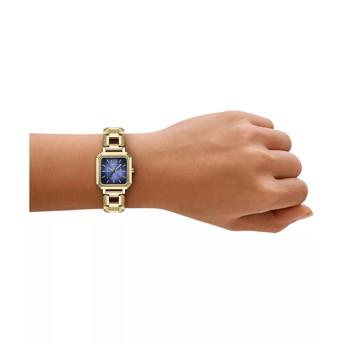 Gold-tone ladies quartz watch with blue dial and linked metal bracelet on wrist