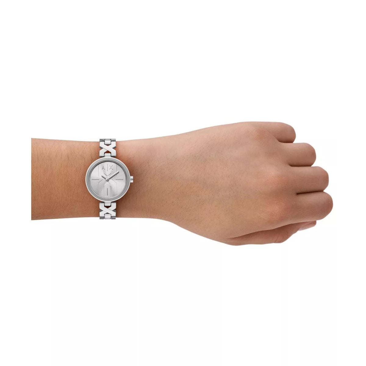 Silver ladies quartz watch on wrist with AX dial and geometric link steel bracelet.