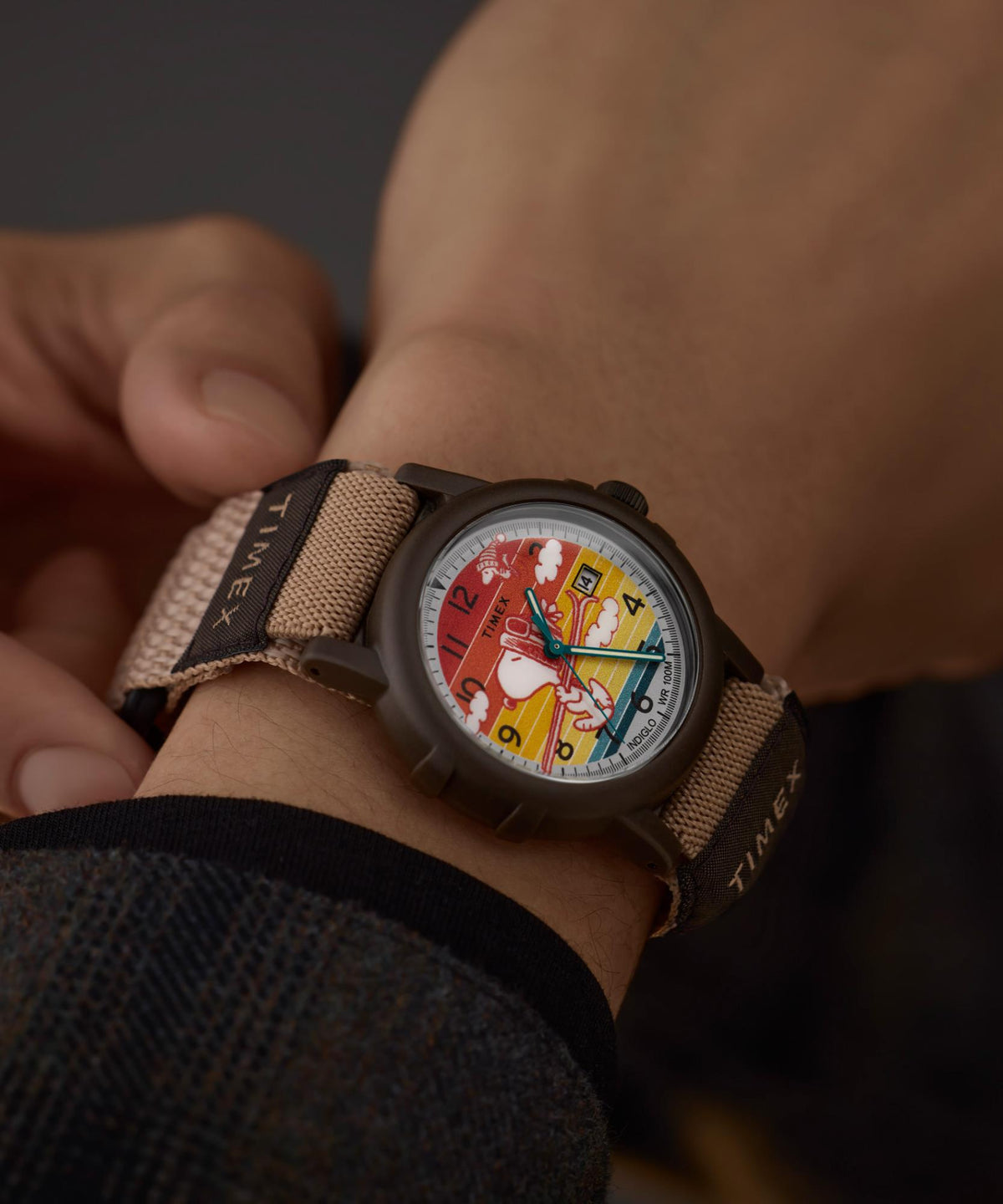 Men's quartz fabric watch with multicolored Peanuts dial and tan web strap