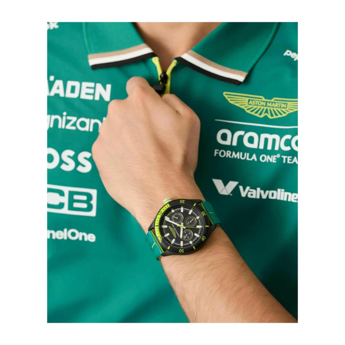 Men's quartz chronograph watch on wrist, black dial with green and yellow silicone strap