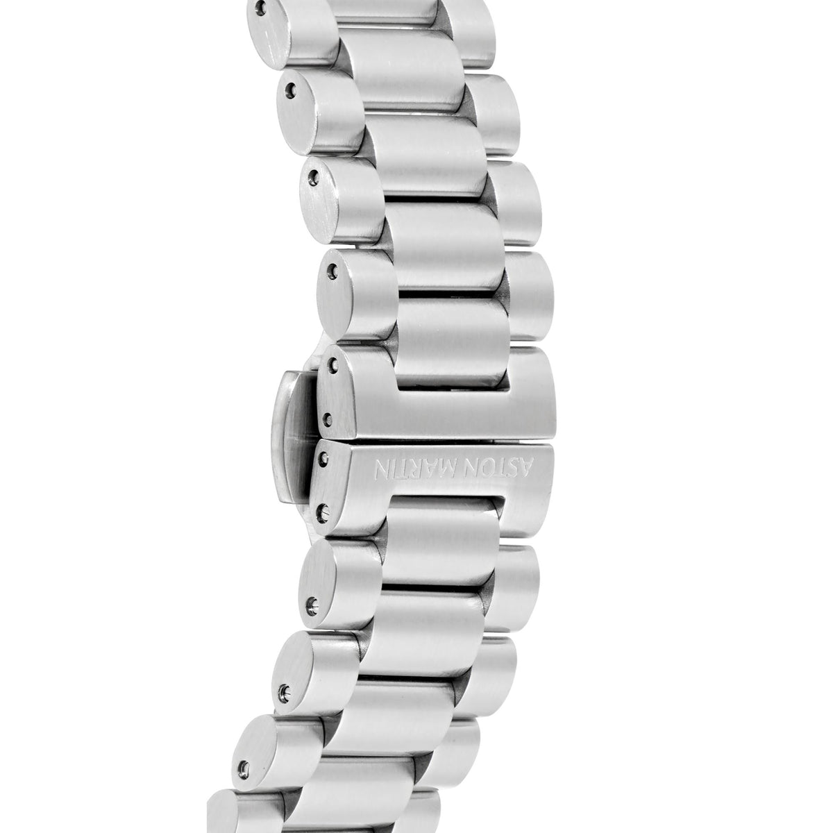 Close-up of Aston Martin RSST stainless steel bracelet links with engraved logo on green dial chronograph watch on white background