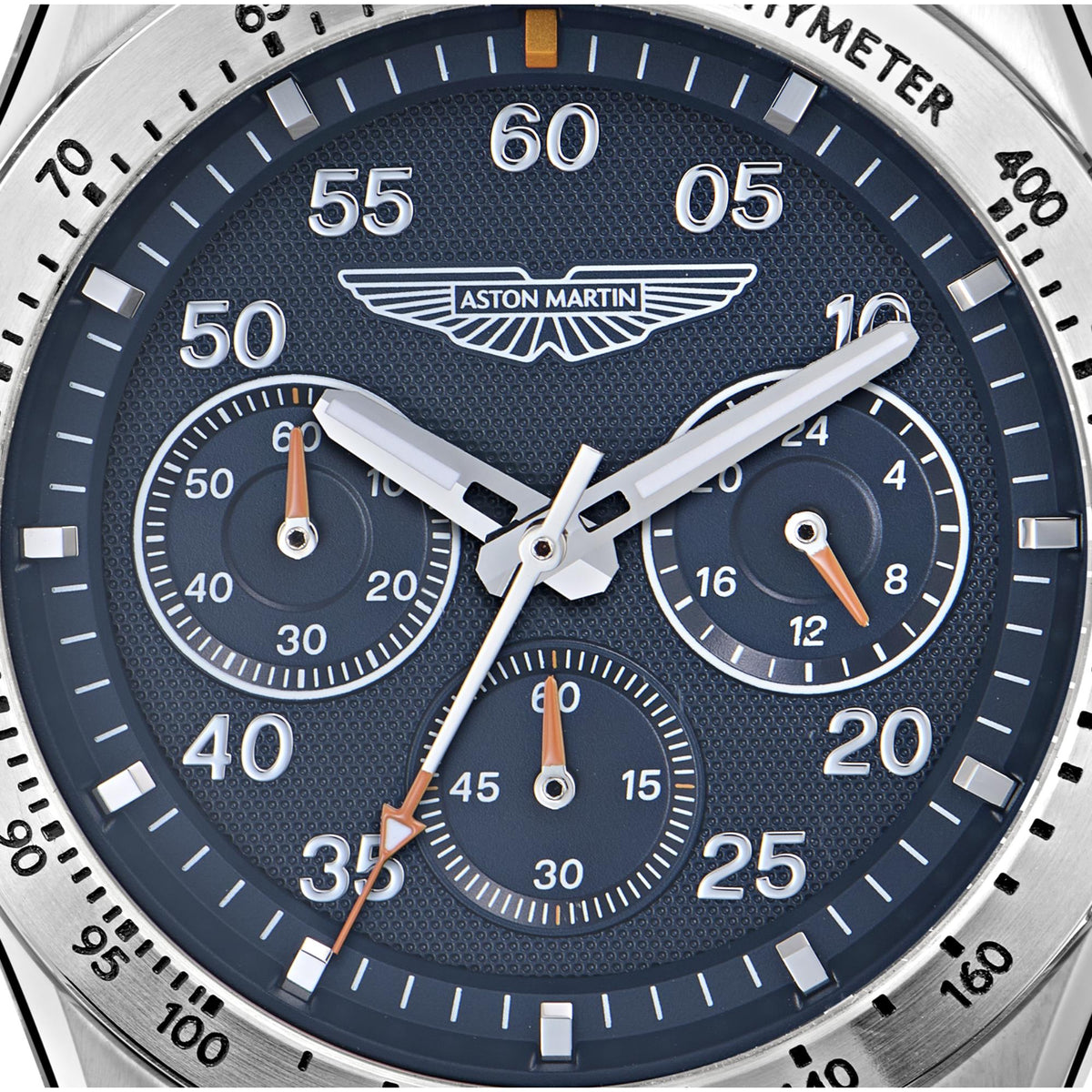 Aston Martin chronograph watch with textured blue dial, subdials, and silver hands.