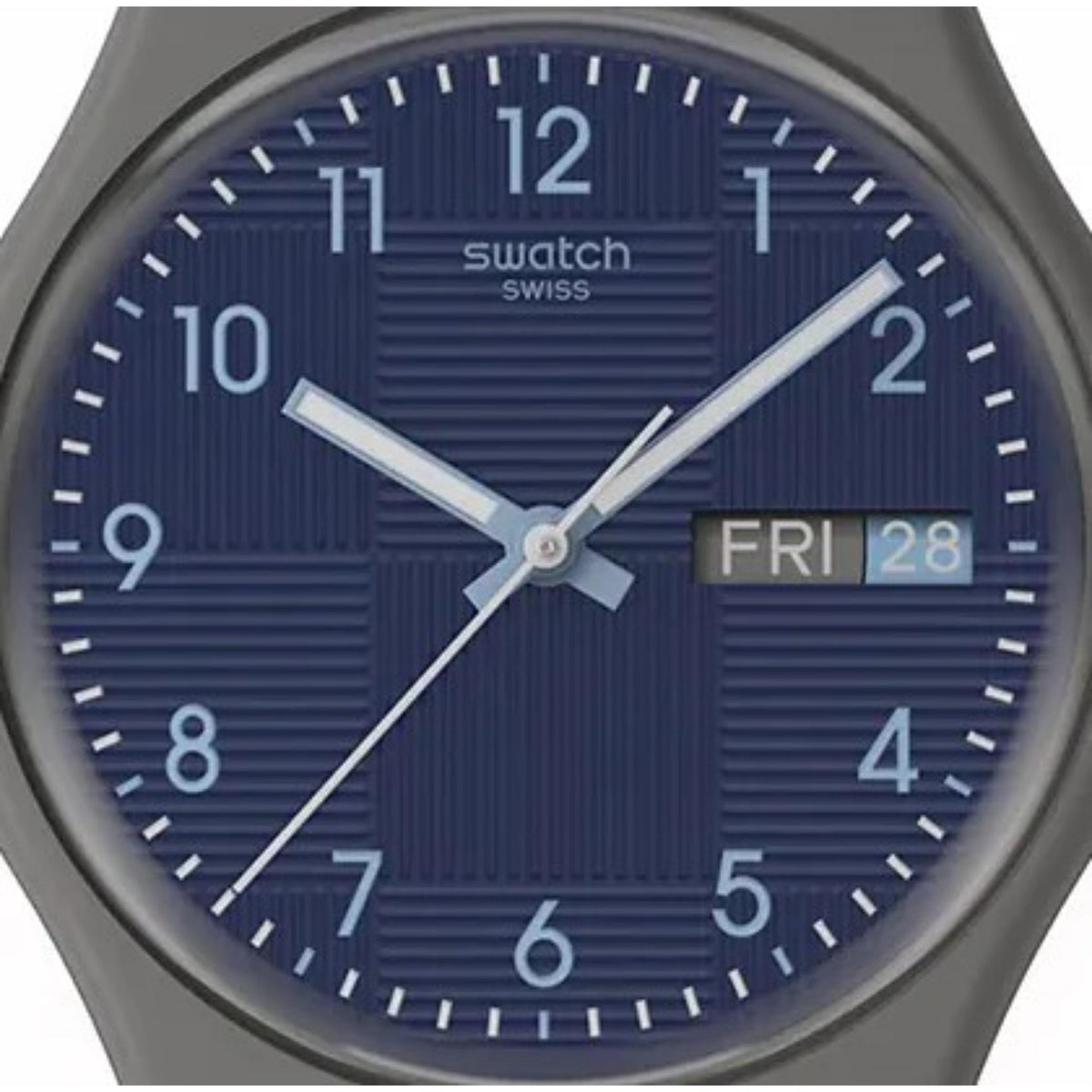 Close-up of dark blue dial analog quartz watch with raised indices and date window