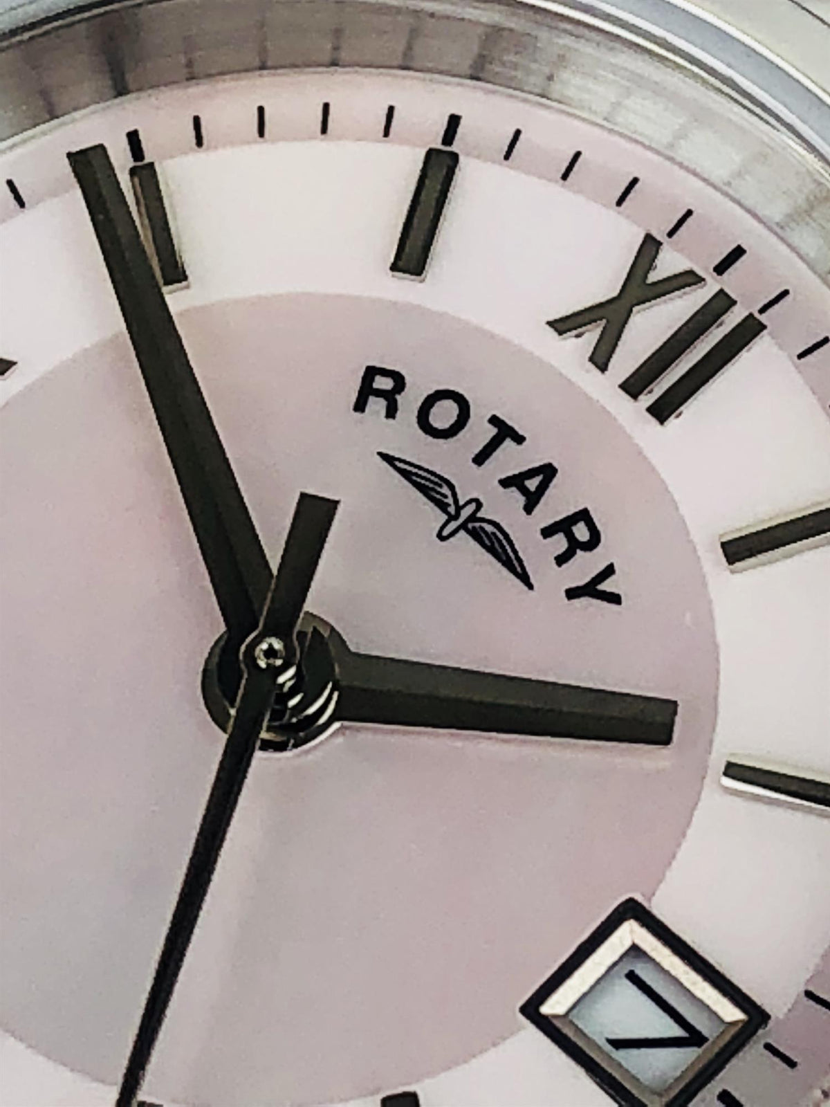 Mother-of-pearl dial wristwatch with Rotary logo, Roman numerals, and black baton hands