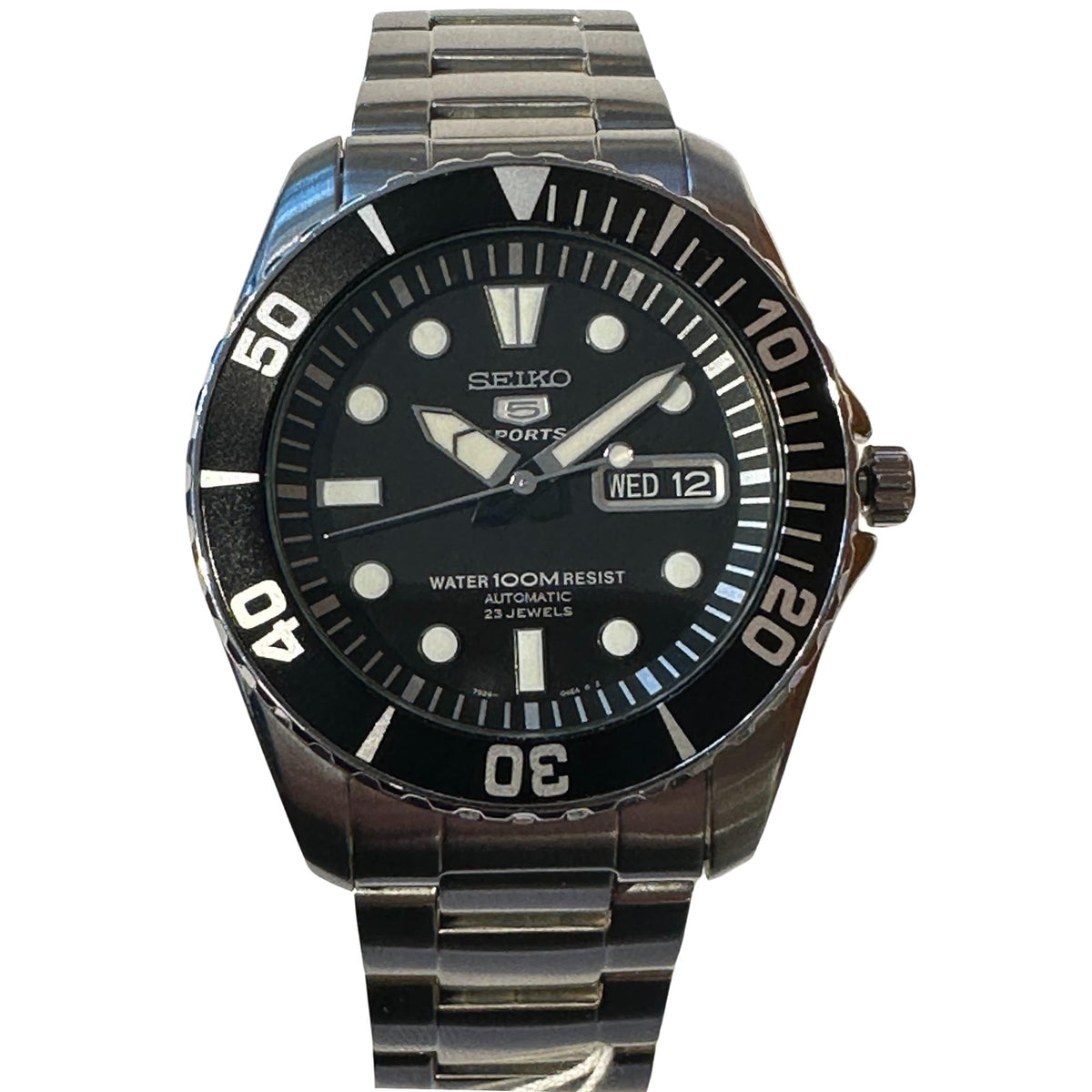 Seiko Sports men's watch with black dial, stainless bracelet, and WED 12 date window