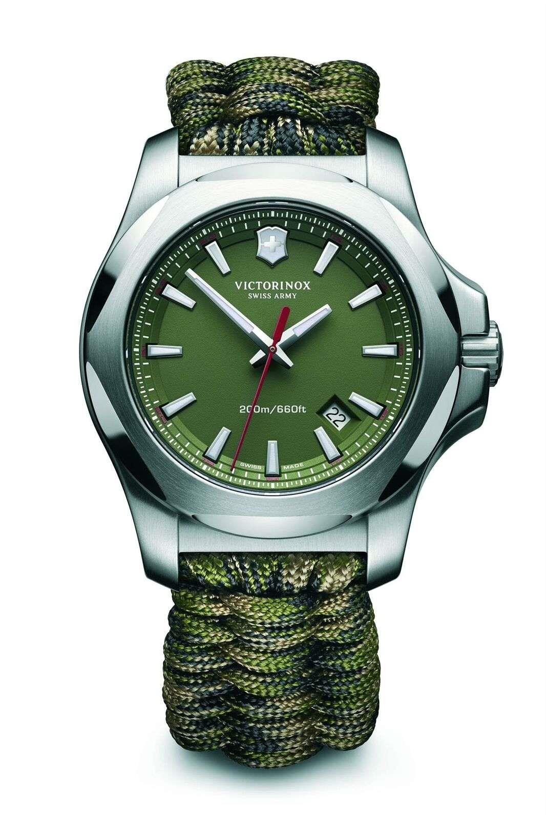 Men's stainless steel wristwatch with dark green dial and olive-green paracord strap, straight-on.