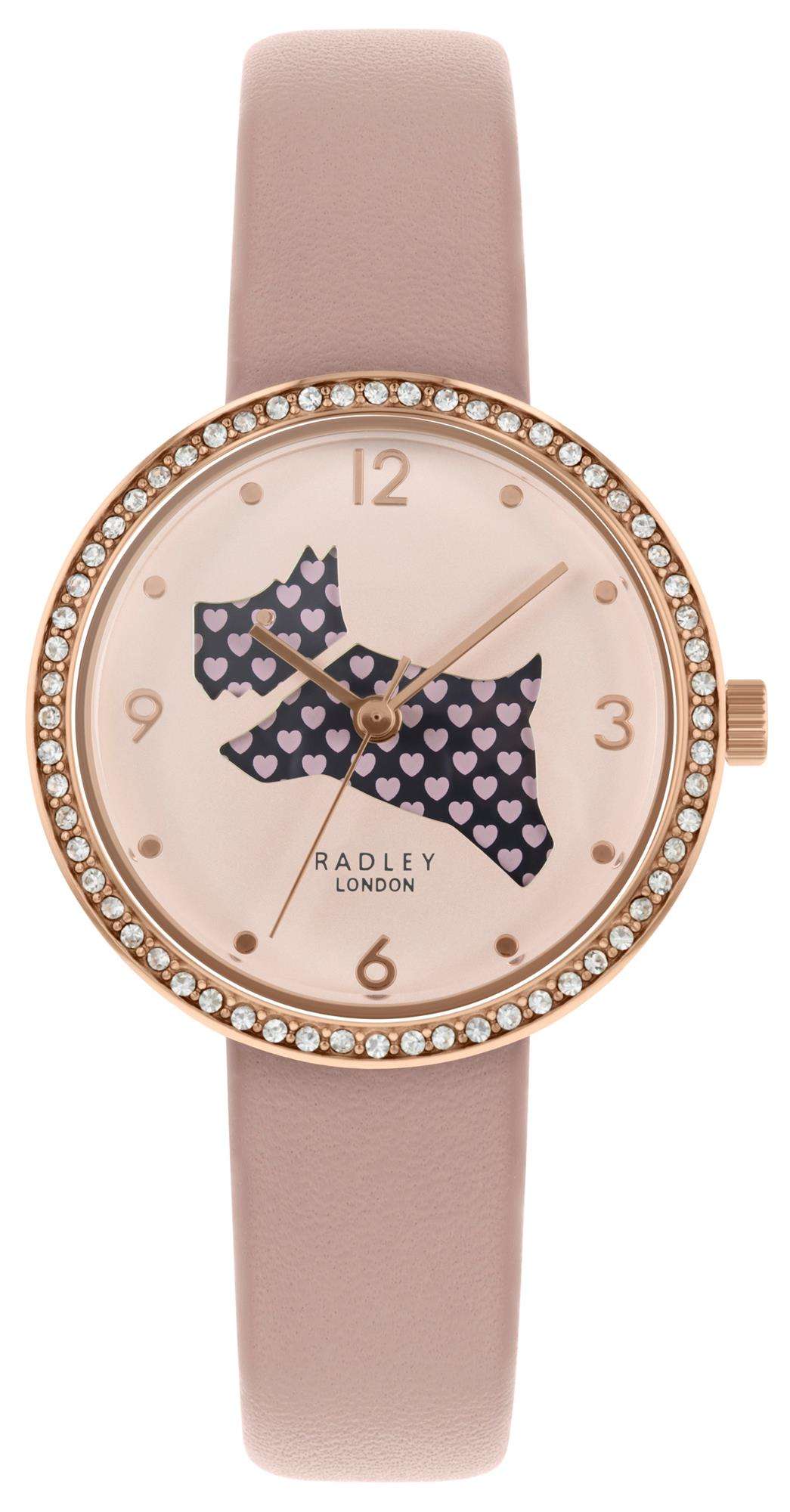 Pink silicone ladies watch showing heart dog dial with rhinestone bezel and crown