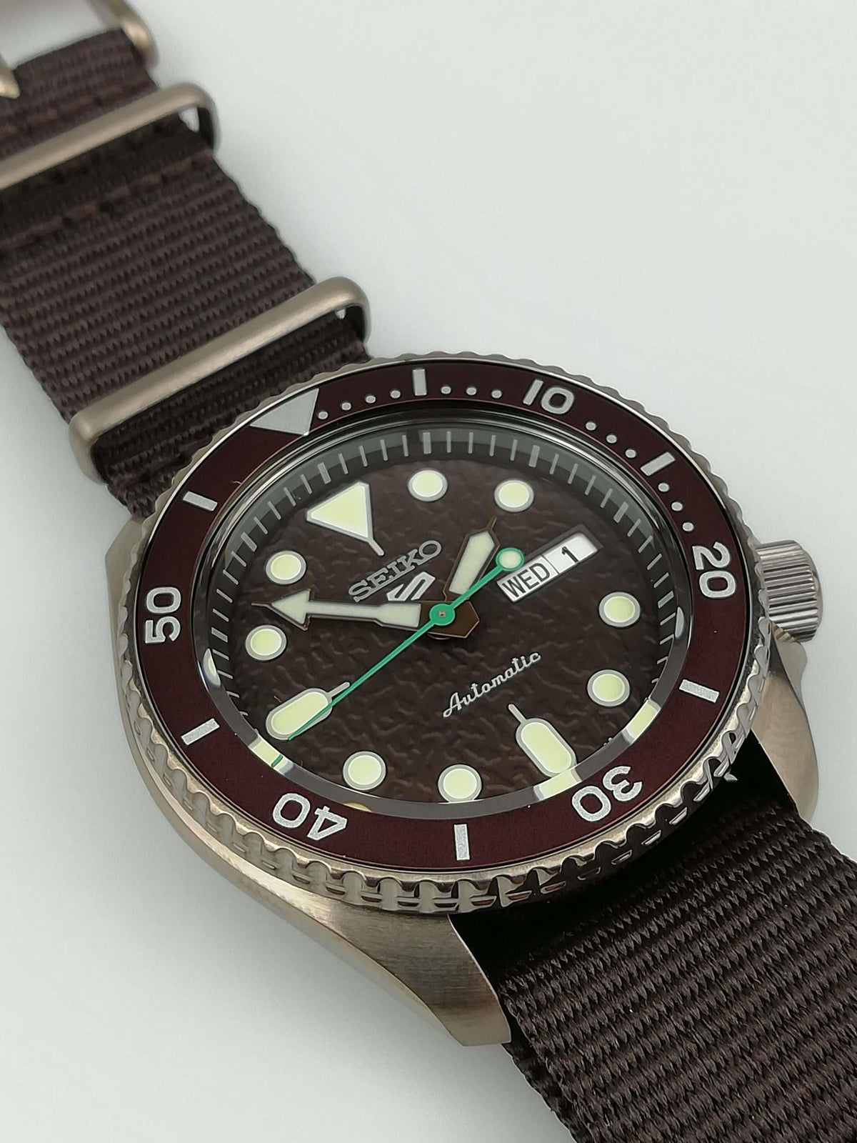 Men's Seiko 5 Sports automatic watch, maroon bezel and dial, brown canvas strap