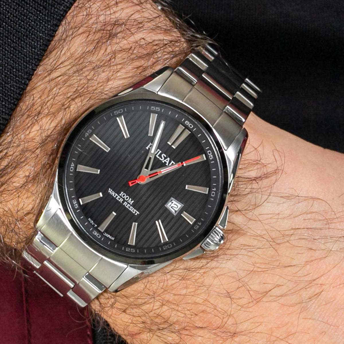 Men's stainless steel quartz watch with black dial, silver bracelet, red seconds hand