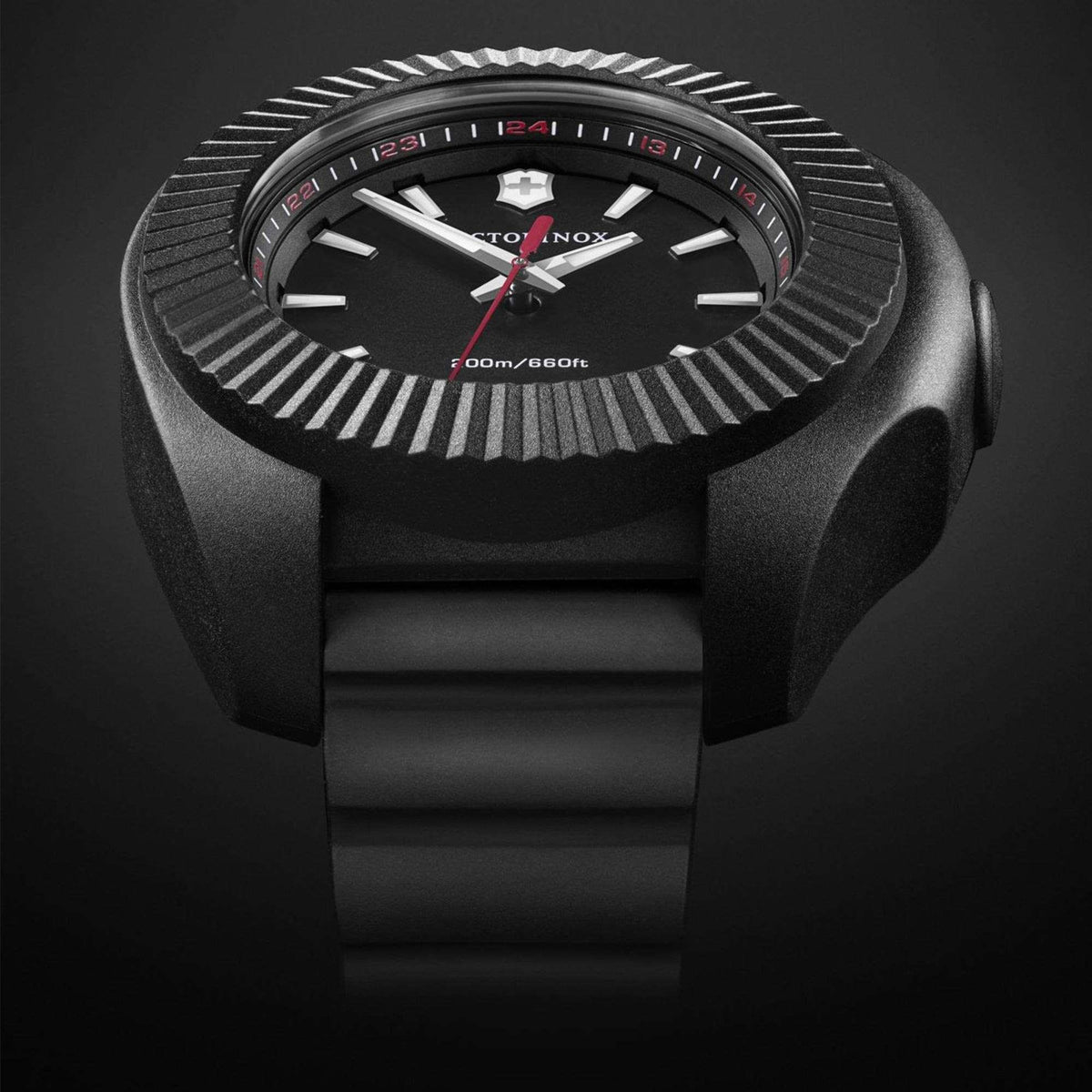 Front close-up of black dial quartz watch with ribbed bezel and red minute markers