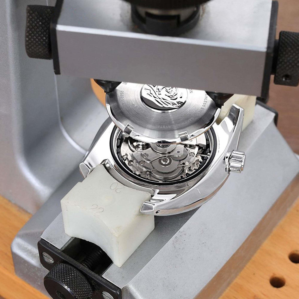 Seiko Prospex Alpinist watch case open, showing mechanical movement and crown