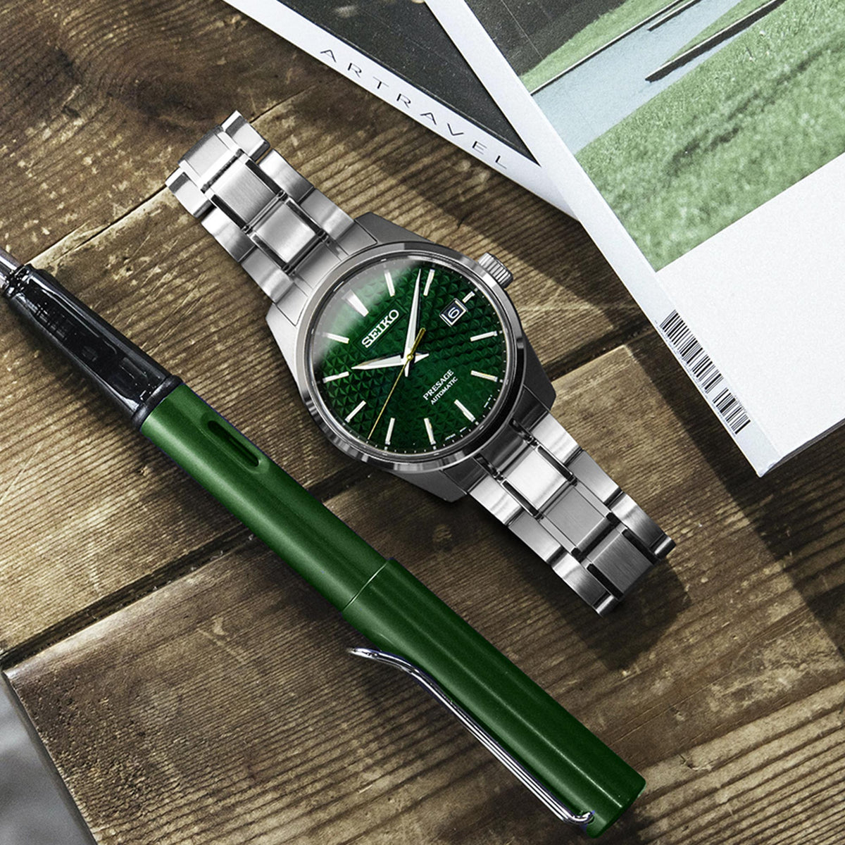 Men's automatic watch with green dial and silver stainless link bracelet, round steel case