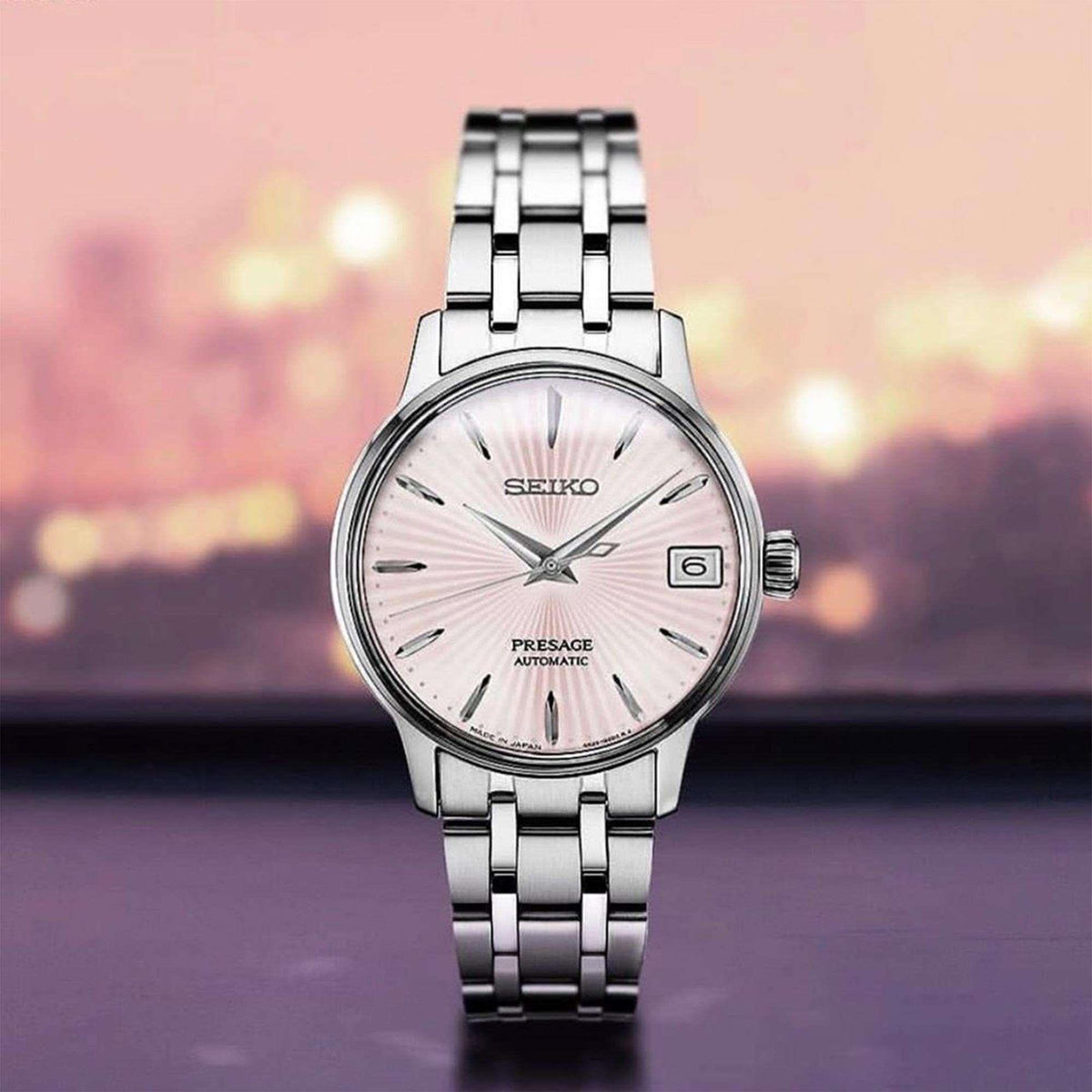 Automatic ladies watch with pink sunray dial and silver link bracelet