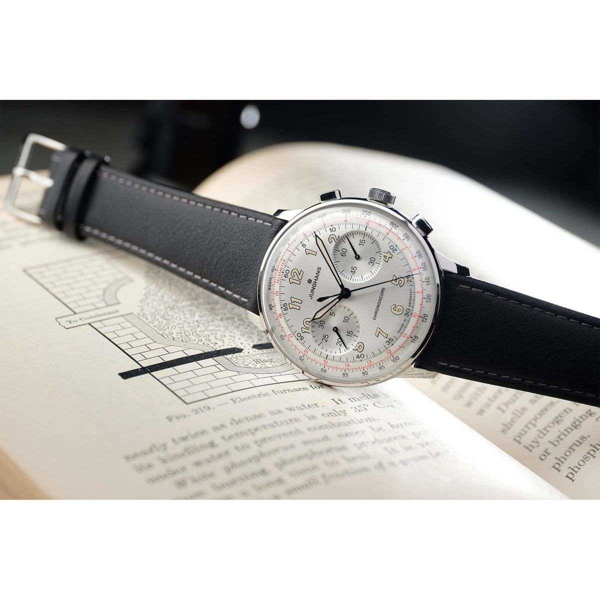 Men's mechanical watch with silver dial, black leather strap, and multiple subdials
