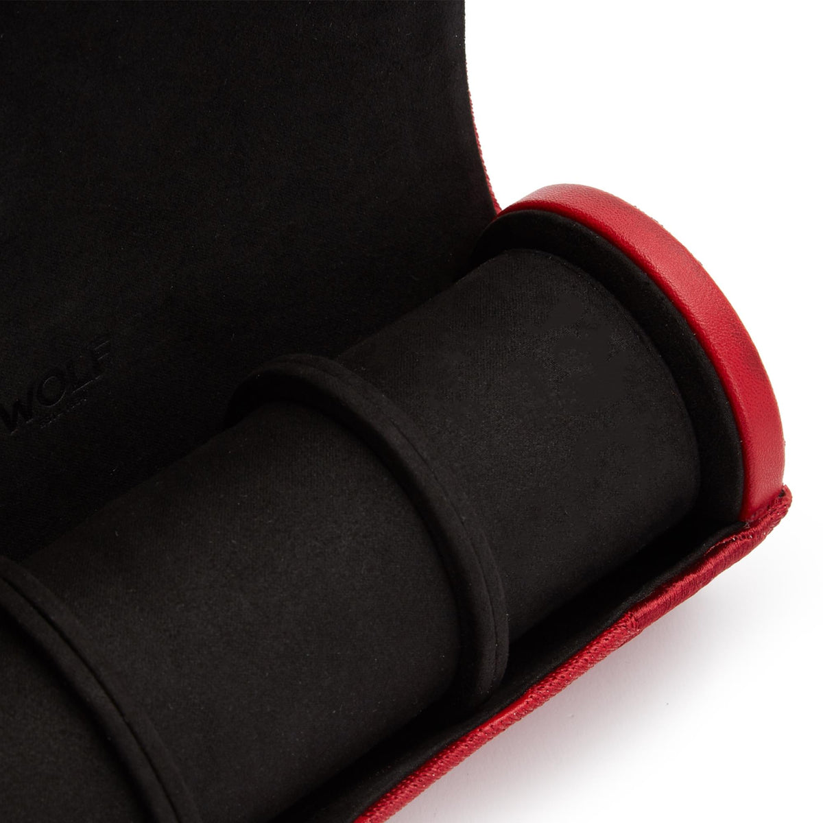 Red watch roll corner showing black padded watch rolls and red trim