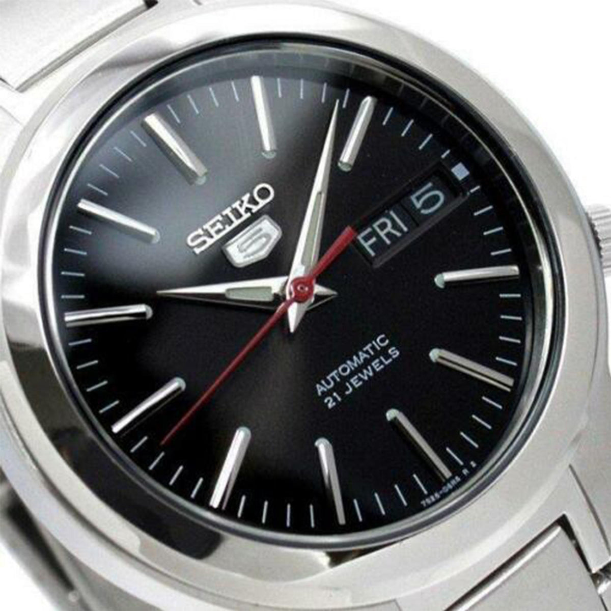 Seiko automatic watch close-up: black dial with red seconds hand and FRI marking