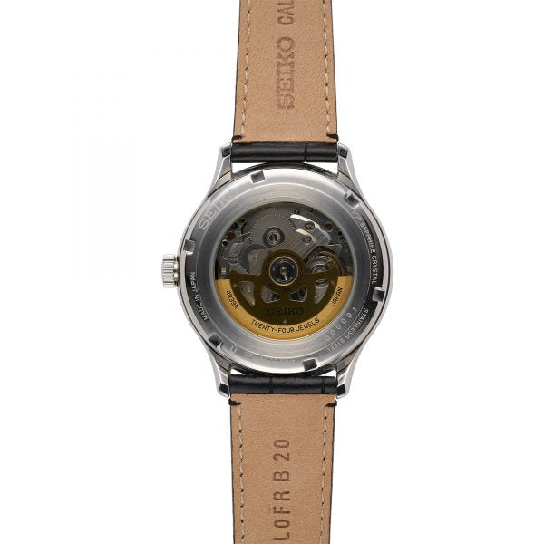 Seiko Presage men's watch case back and black leather strap with tan stitching