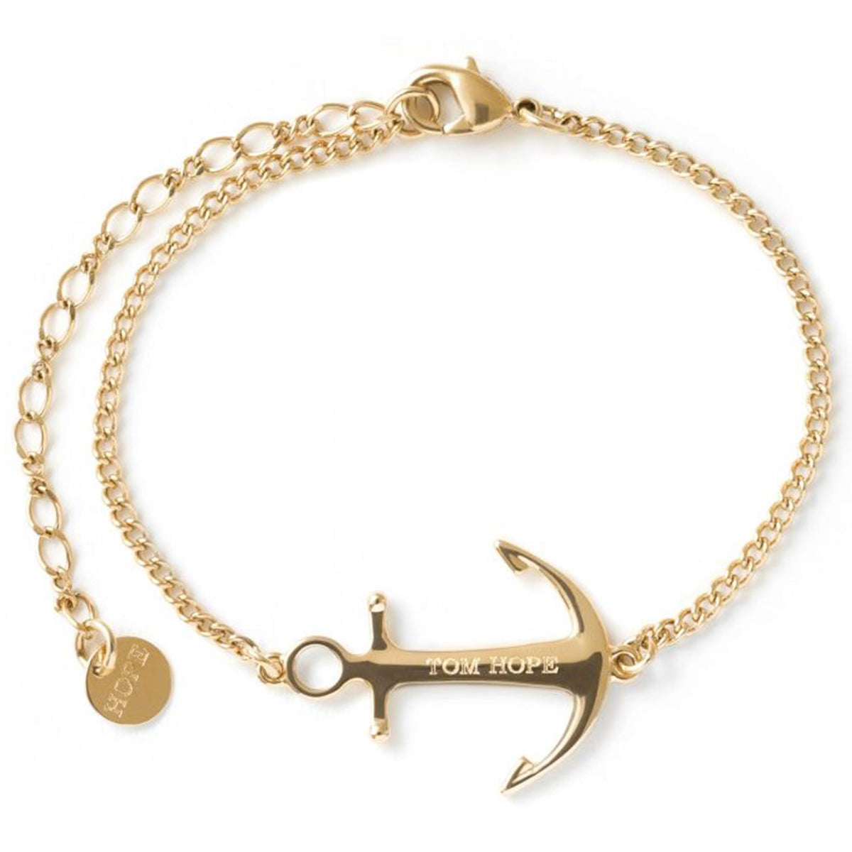 Gold-plated bracelet featuring anchor-cross saint charm and small round tag on side