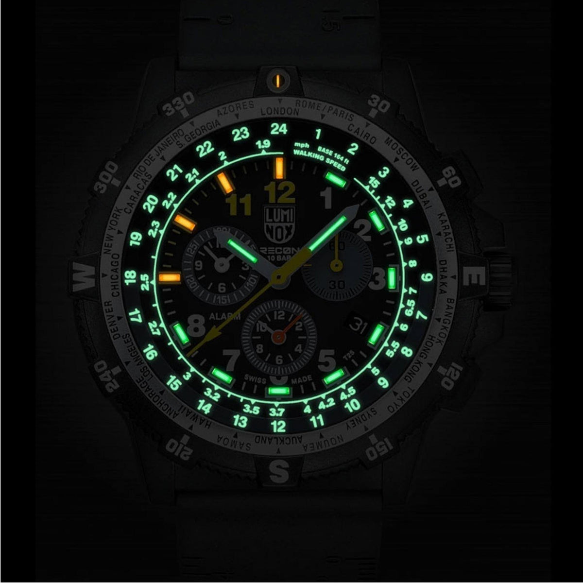 Men's Luminox chronograph watch with green illuminated dial and black silicone strap.