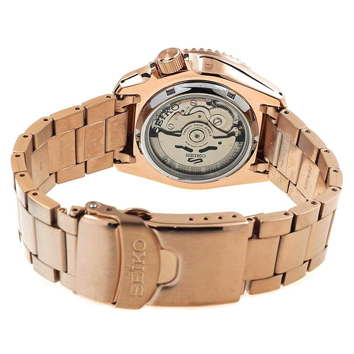Rose gold automatic watch caseback with visible movement and linked bracelet