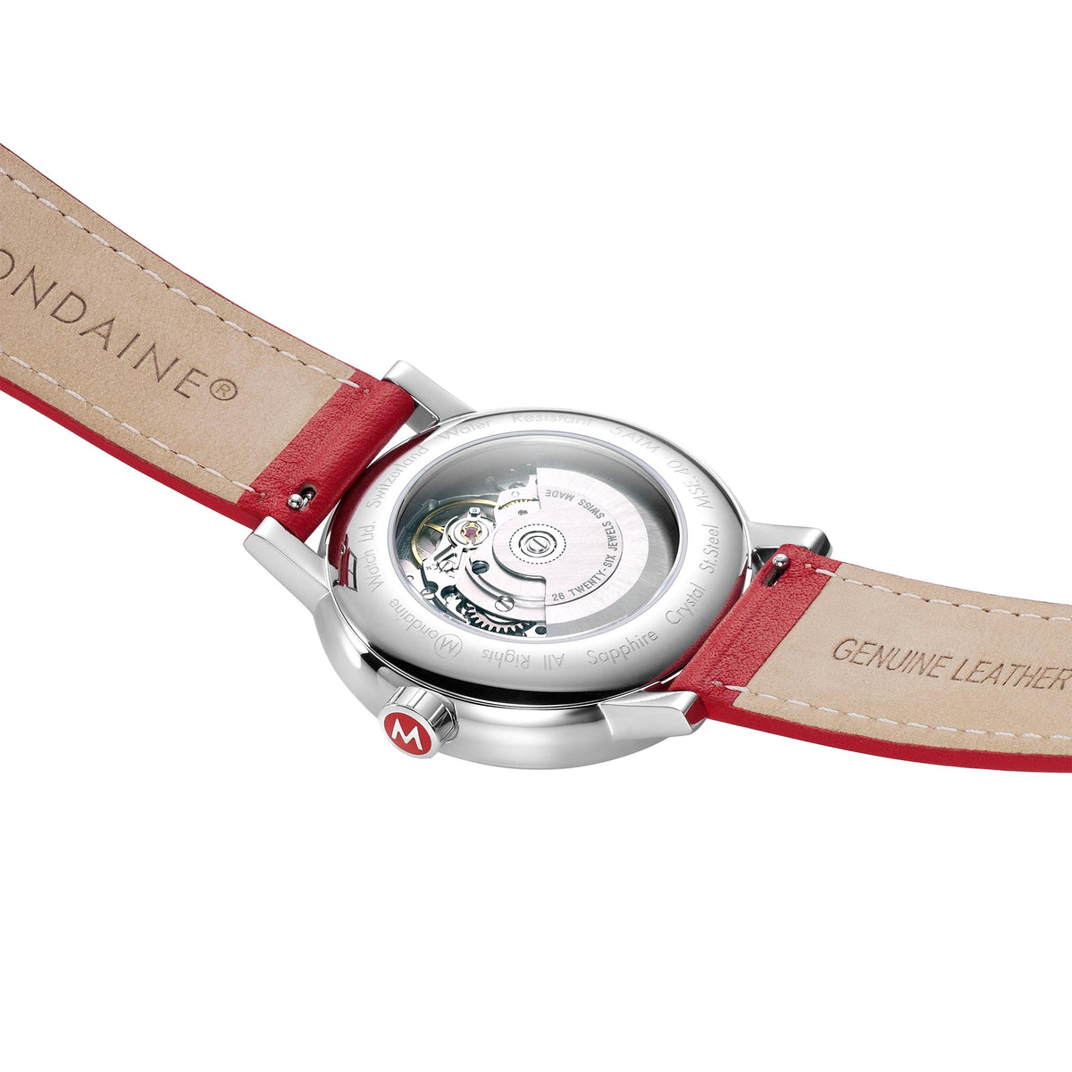 Mondaine watch caseback with red and tan strap underside, “Genuine leather” branding