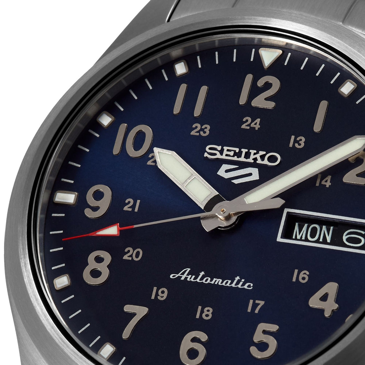Close-up of men’s automatic blue dial with SEIKO logo and MON day-date at 6