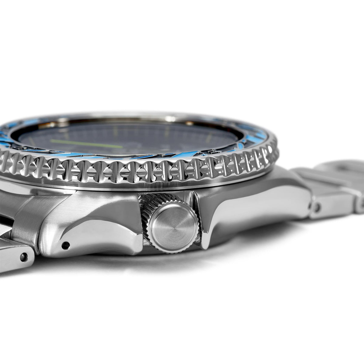 Stainless steel watch case side view with crown and ribbed bezel, linked metal bracelet