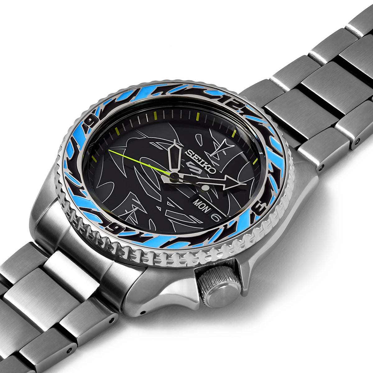 Angled view of stainless steel watch with black patterned dial, blue bezel, and bracelet