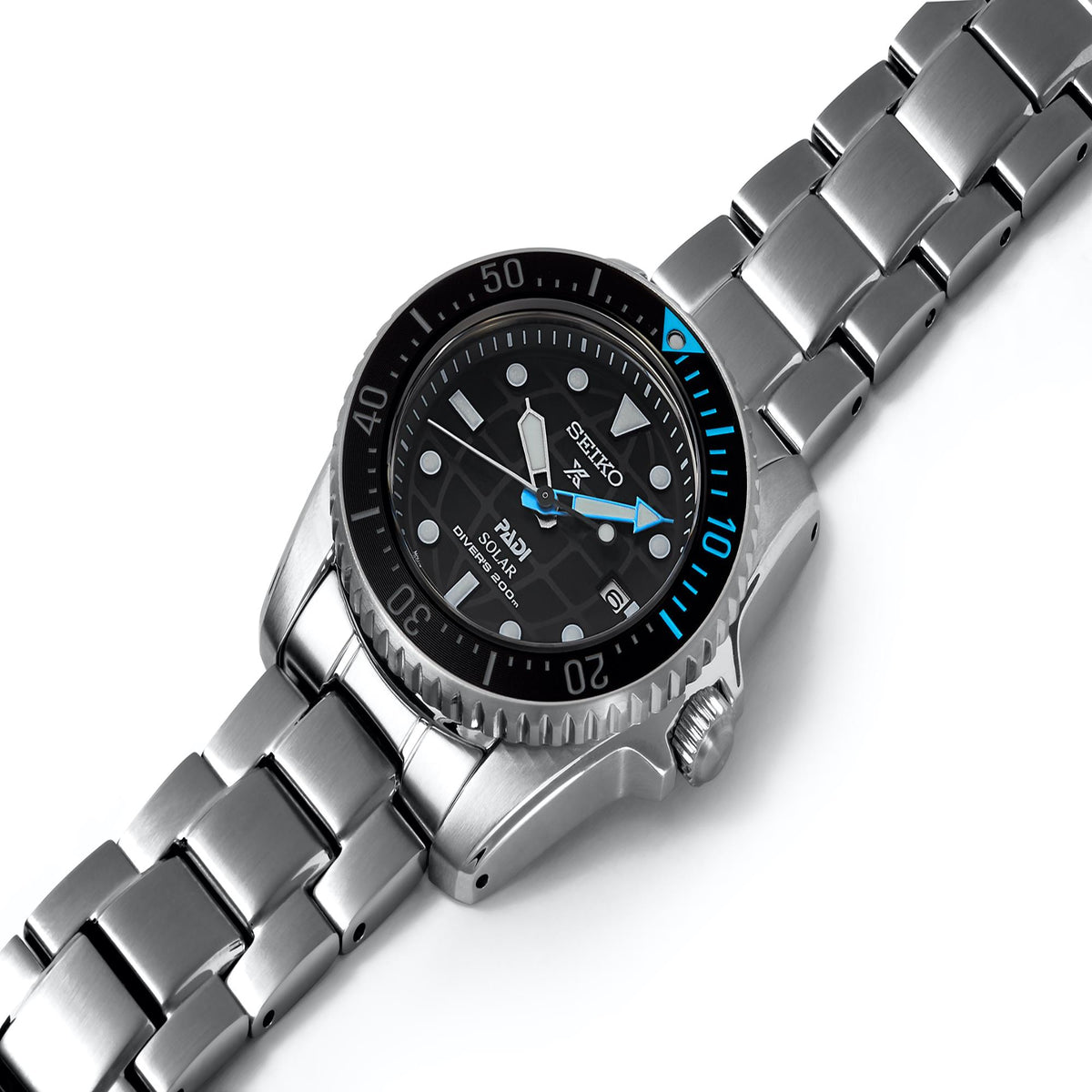 Angled view stainless solar dive watch with black dial and blue minute track bezel