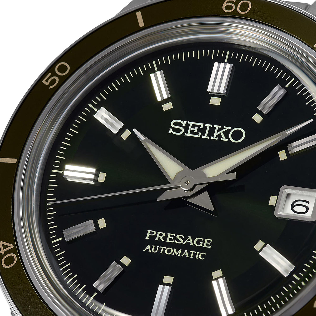 Black dial automatic wristwatch face with SEIKO text, baton indices, and date window