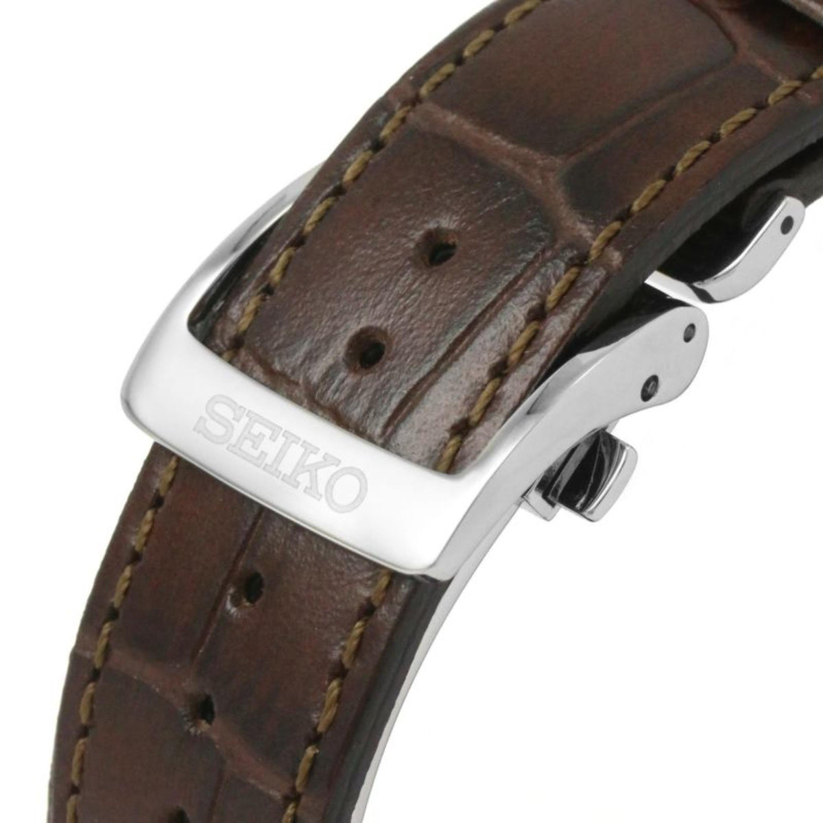 Brown leather strap close-up with stitched edge and metal buckle hardware