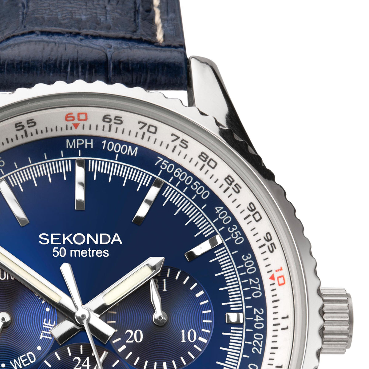 Close-up of blue dial quartz watch with subdials, silver hands, and tachymeter bezel markings