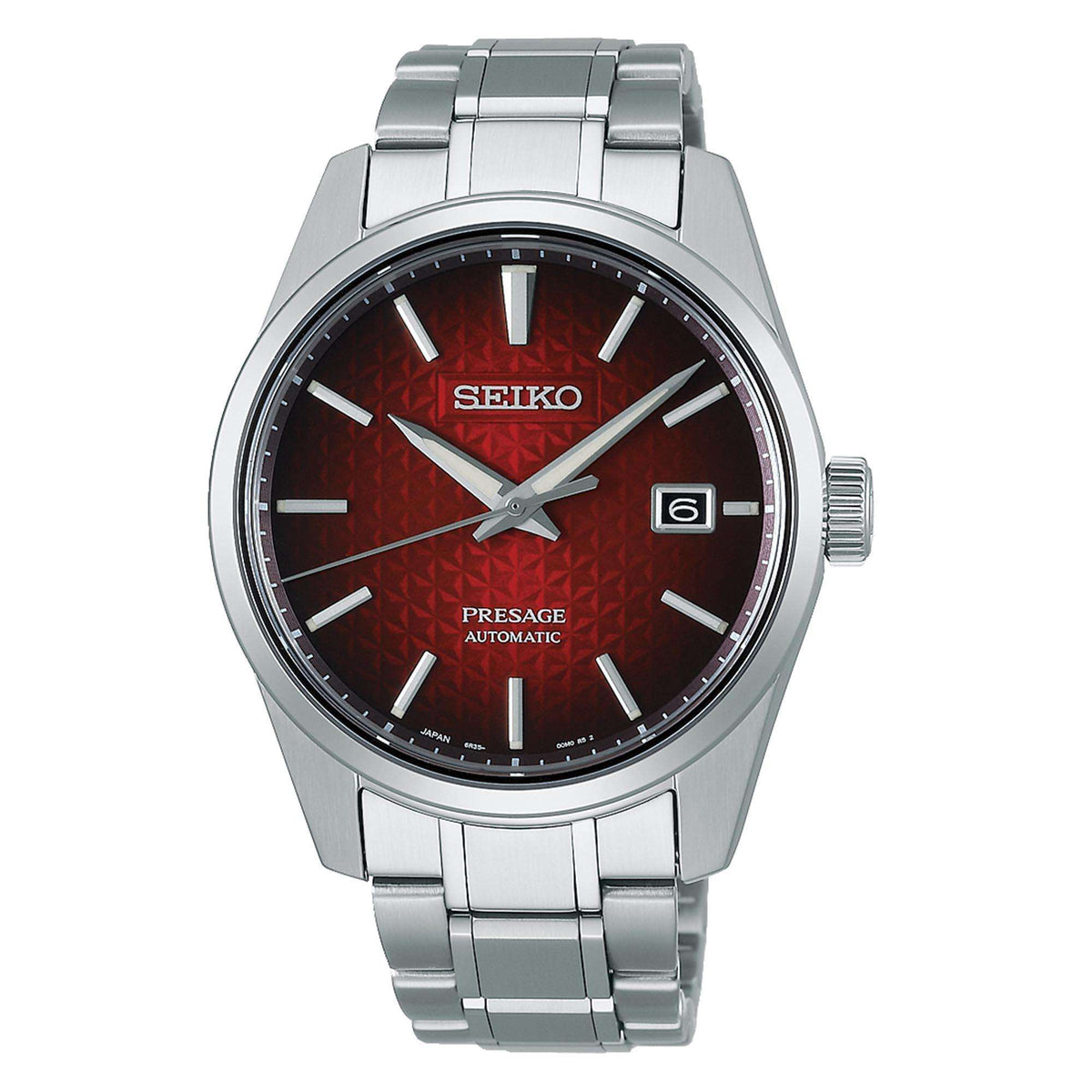 Red patterned automatic watch dial with Seiko logo, silver hands, and date window at 6