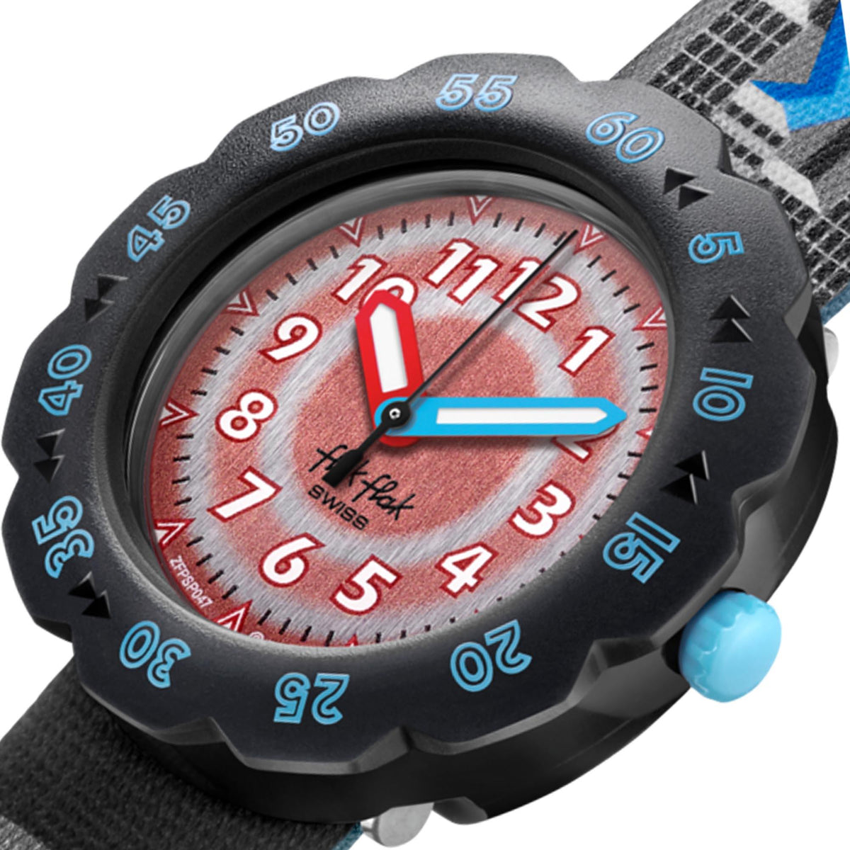 Close-up childrens watch with red dial, blue hands, and black spiked bezel with minute marks